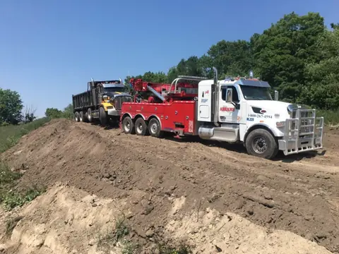 Abrams heavy wrecker performing off-road recovery